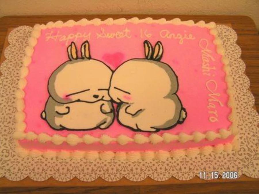 Pink rectangular sheet cake featuring a printed Mashimaro bunny design with white icing borders and a Happy Sweet 16 Angie message.