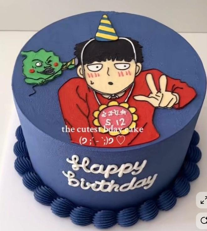 Blue Mob Psycho 100 anime birthday cake with hand-piped character illustration and Happy Birthday message.