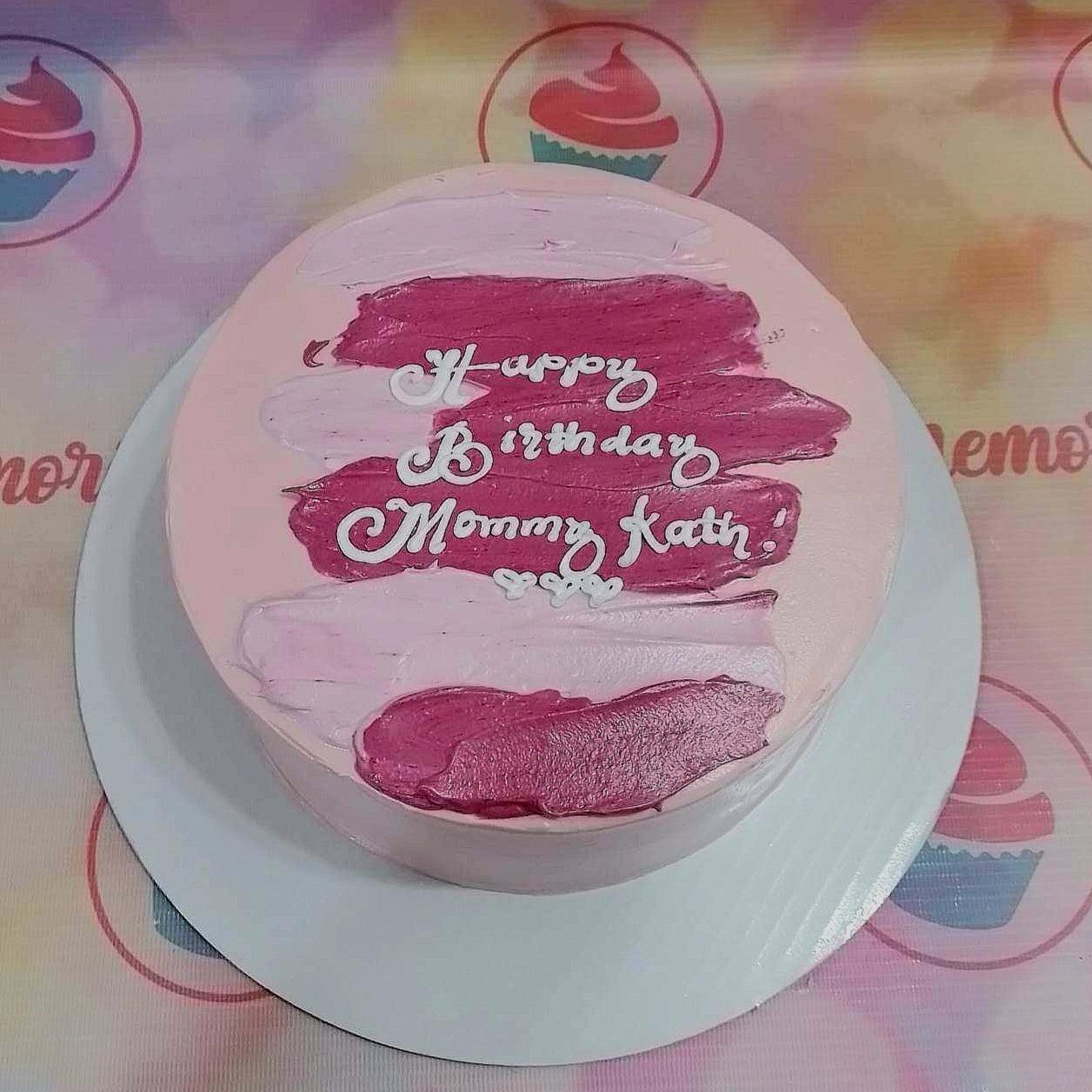 Pink bento cake with dark pink palette knife icing strokes and white piped birthday message for Mommy Kath.