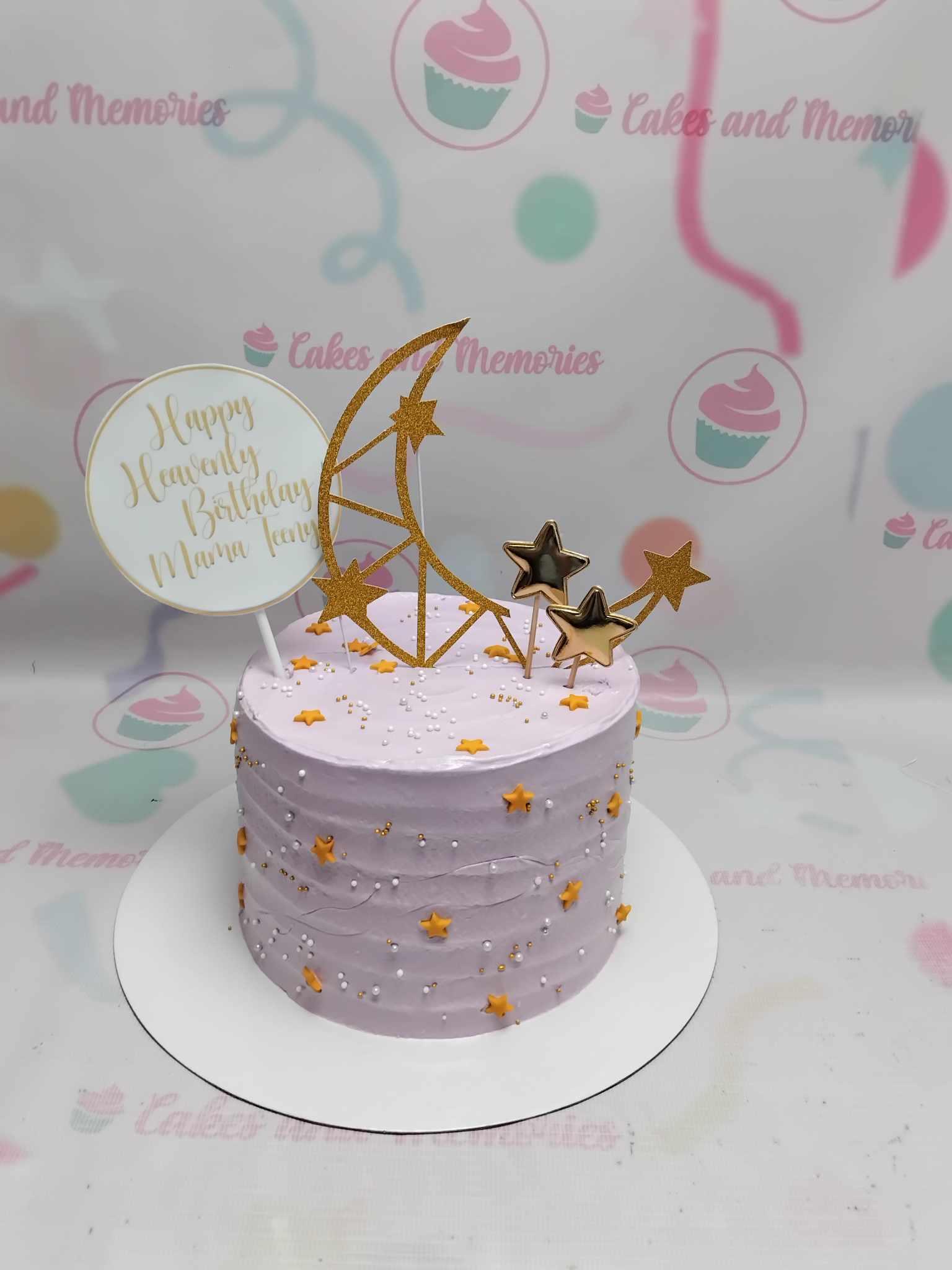 Lavender 1-tier birthday cake with gold moon and star toppers, white and gold pearls, and a personalized message.