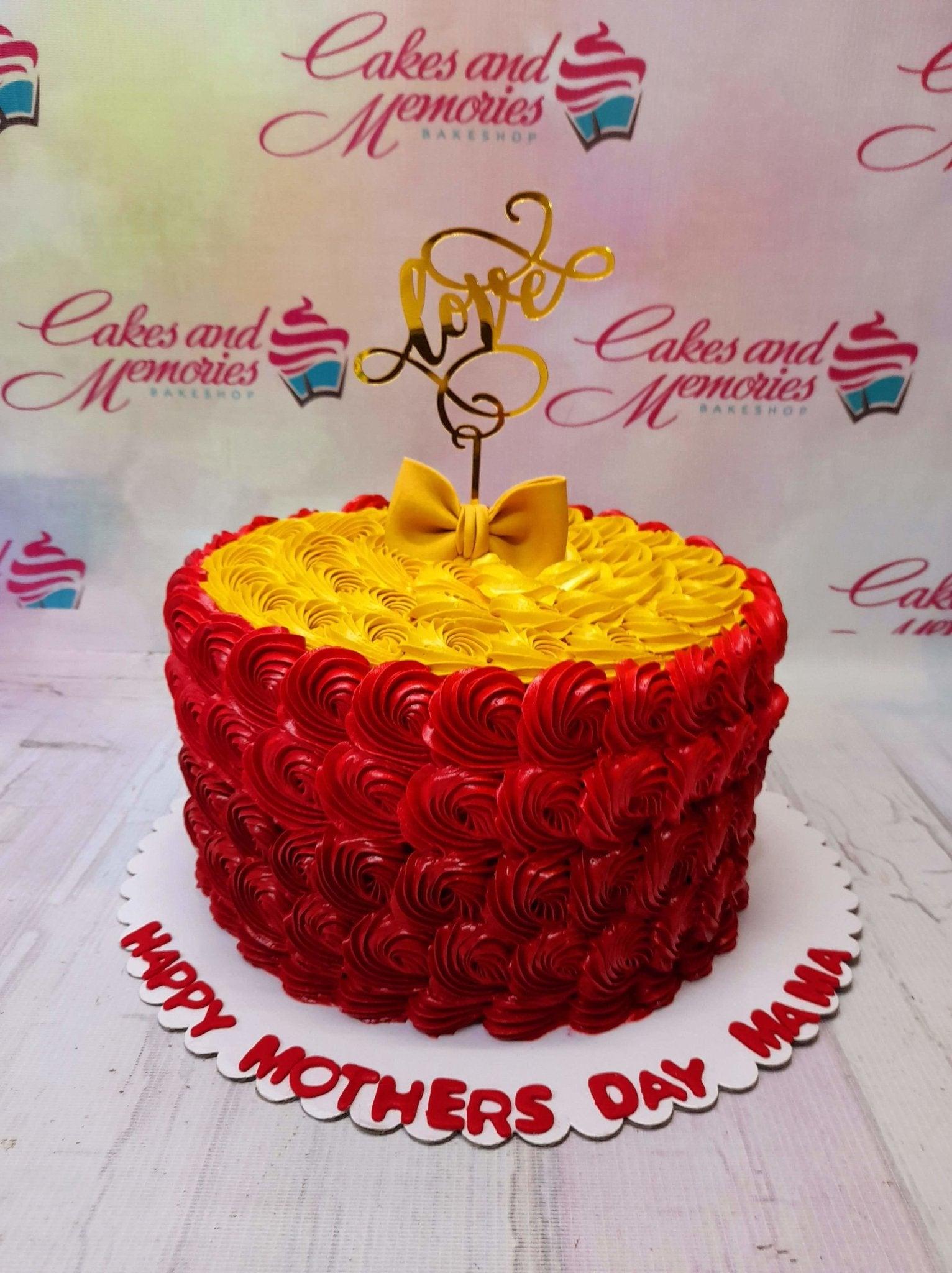 Red and yellow rosette cake for Mother's Day with a gold love topper and a yellow fondant bow.