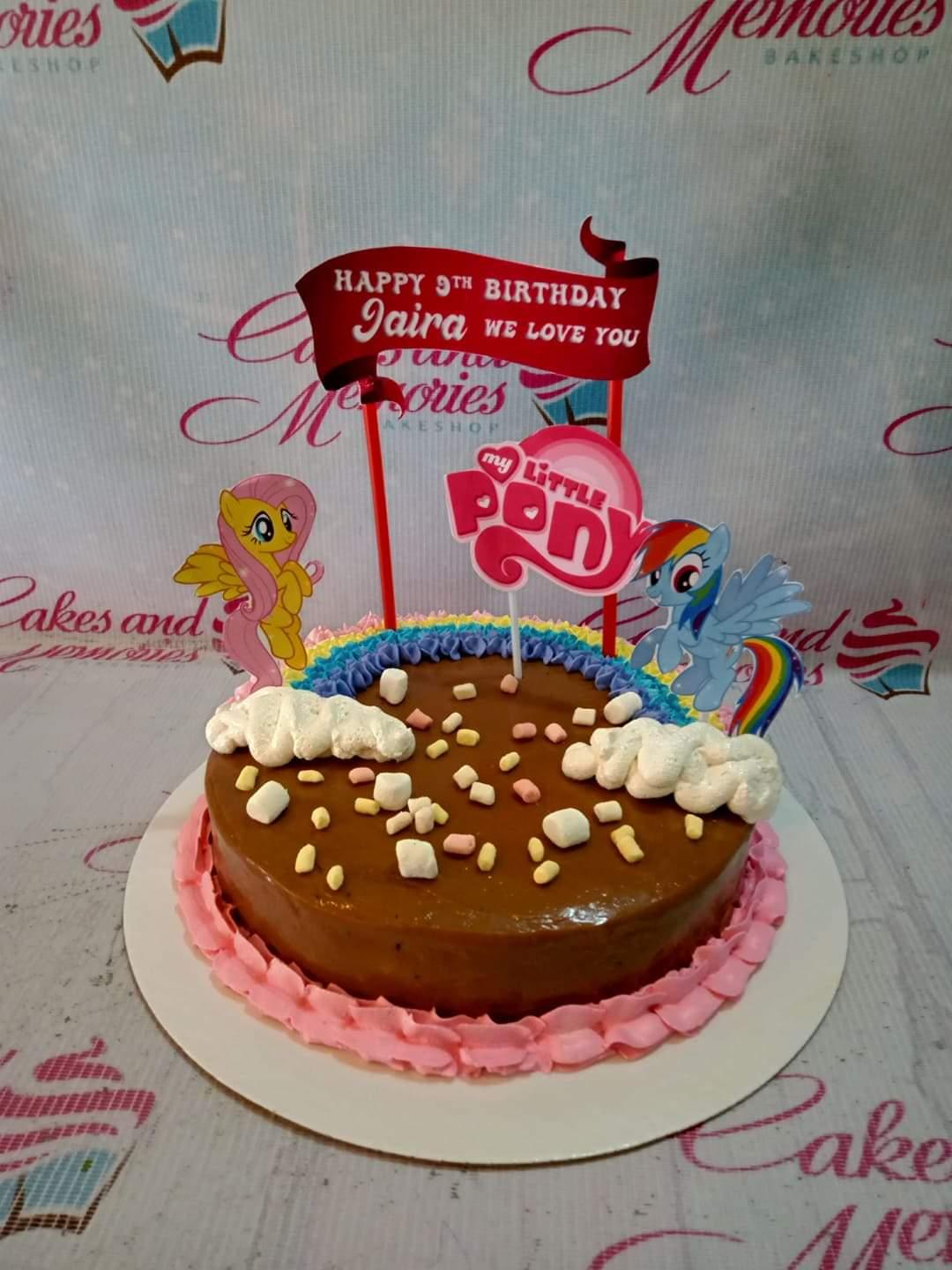 My Little Pony themed chocolate cake with rainbow icing, marshmallows, and character printouts for a 9th birthday.