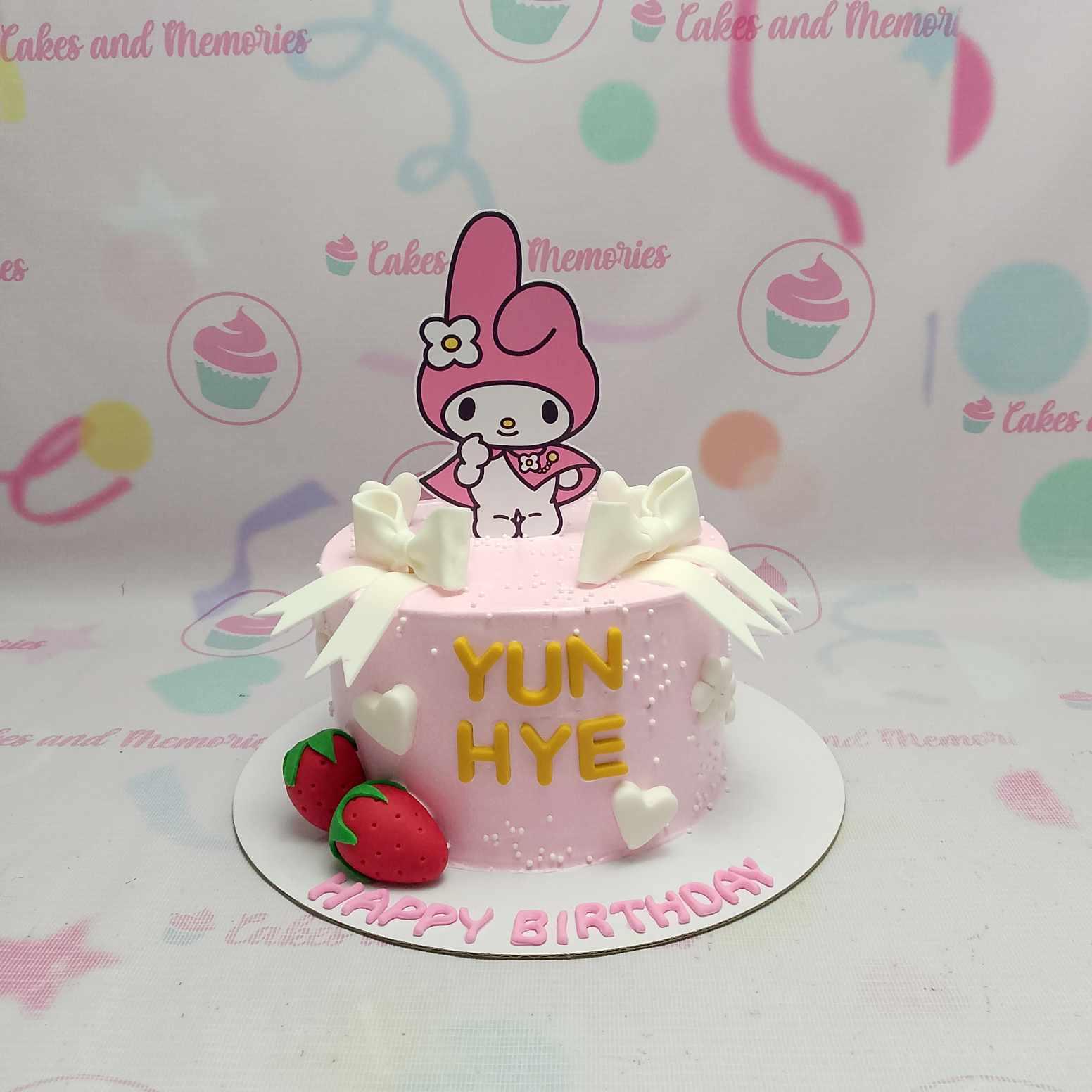 Pink My Melody birthday cake with fondant strawberries, white bows, and yellow gumpaste letters for Yun Hye.