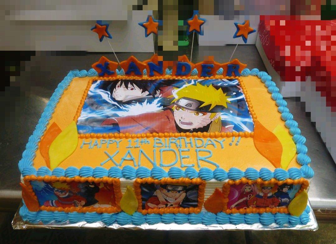 Naruto and Sasuke themed rectangle birthday cake with orange icing, blue borders, and printed character toppers for Xander's 11th birthday.