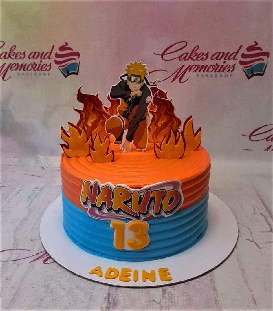 Naruto themed birthday cake with orange and blue horizontal icing ridges, fire cutouts, and a Naruto character topper.