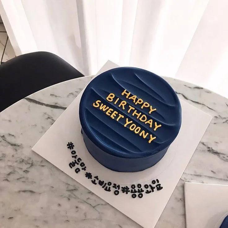 Navy blue minimalist bento cake with textured icing and gold Happy Birthday Sweet Yoony message.