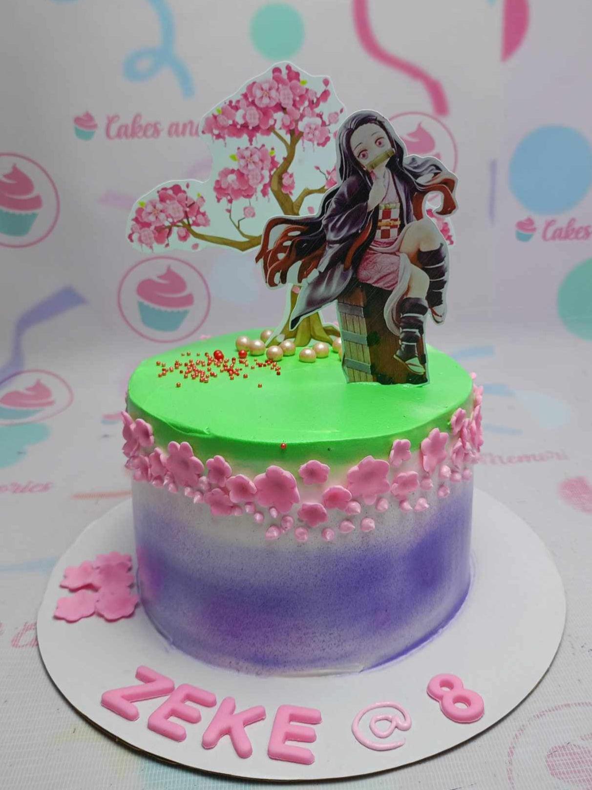 Nezuko Demon Slayer themed cake with purple and green gradient icing, pink cherry blossom decorations, and character printouts.