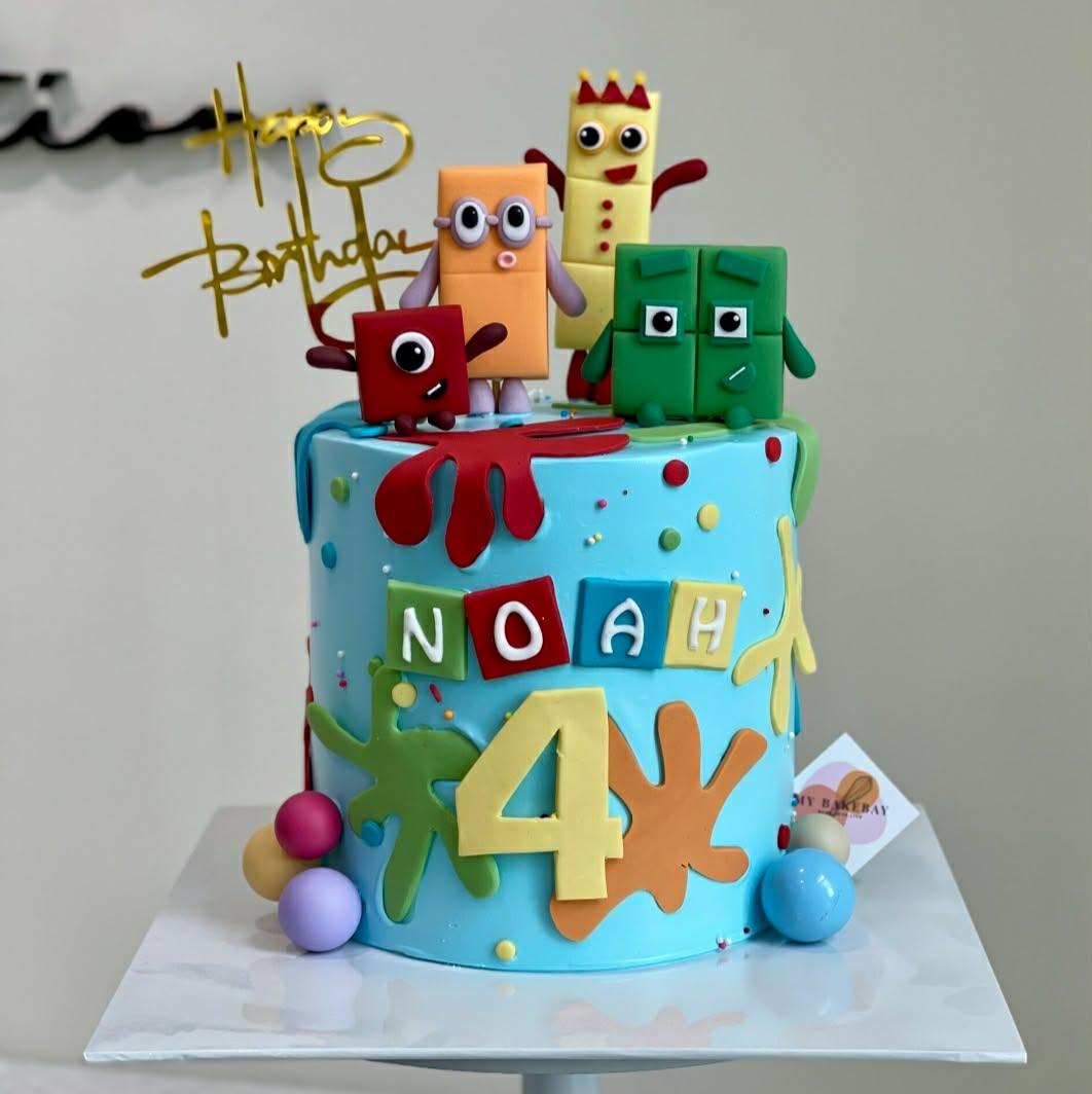 Numberblocks 1 Tier - gold theme with Gold Happy Birthday script topper and Fondant paint splashes on side and top