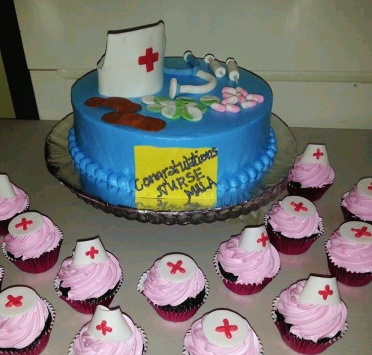 Blue nurse graduation cake with fondant medical tools including a stethoscope, pills, and a nurse hat topper.