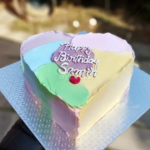 Heart-shaped bento cake with colorful pastel palette knife icing strokes and a Happy Birthday Samin message.