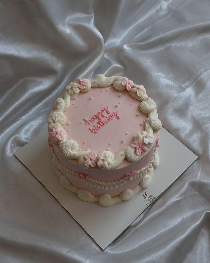 pink birthday 1 Tier - white, pink, red theme with white icing swirls on top border
