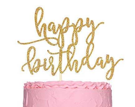 Pink minimalist birthday cake with a large gold glitter Happy Birthday cardstock topper and pink icing ruffles.