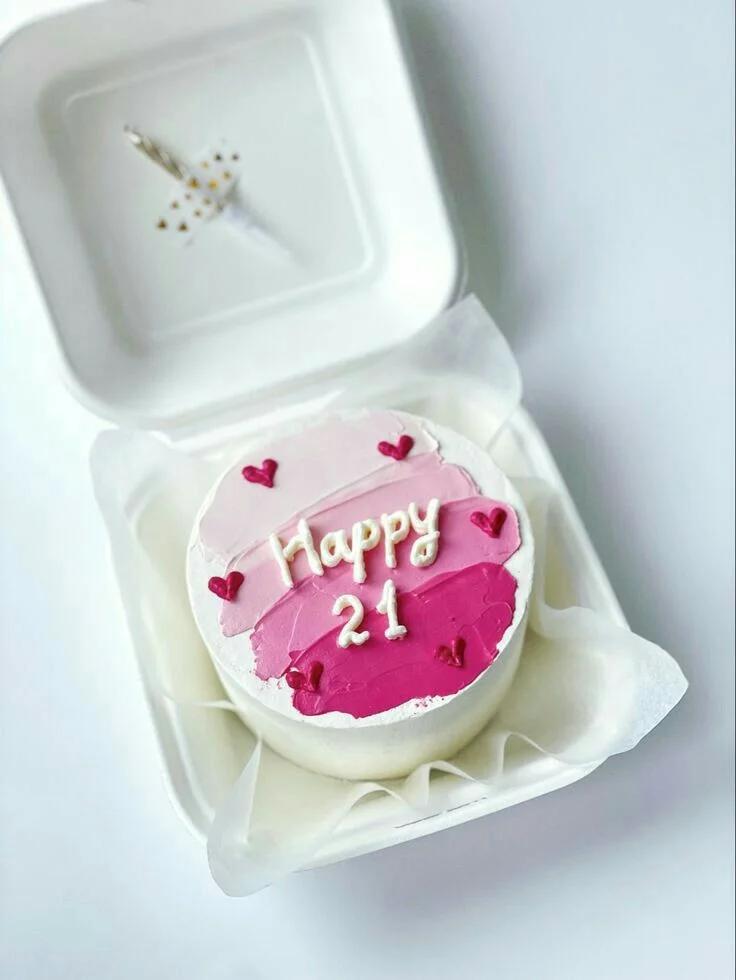 Pink bento cake with palette knife icing in shades of pink and red hearts, featuring a Happy 21 message.