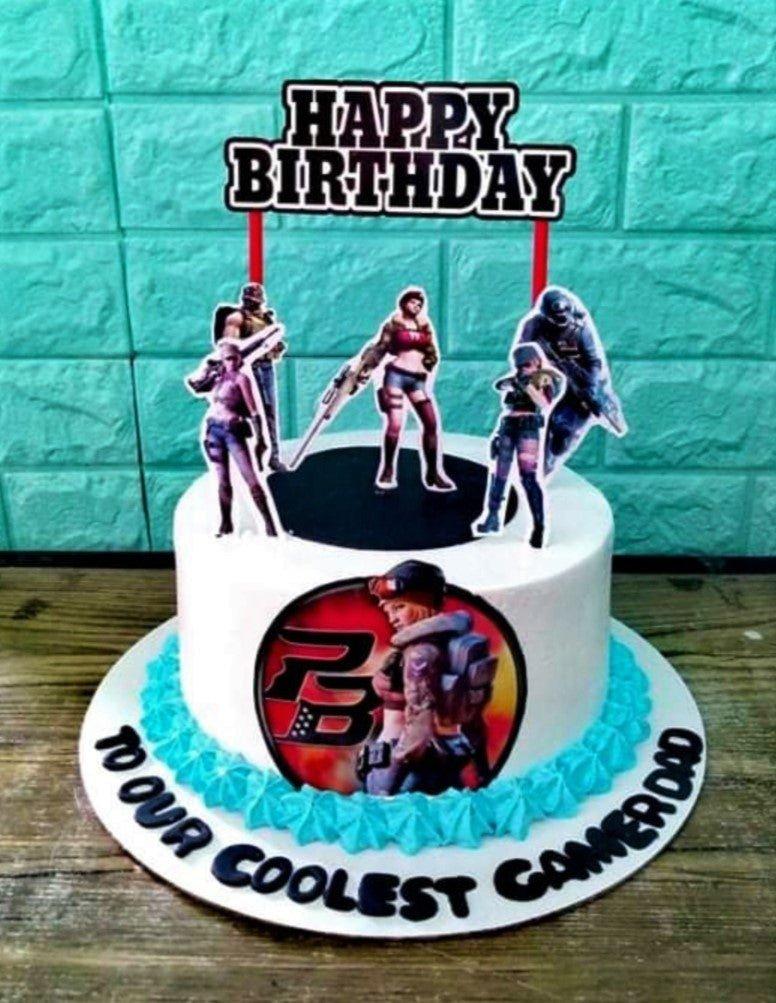 White 1-tier gamer birthday cake with Point Blank character printouts and blue icing border