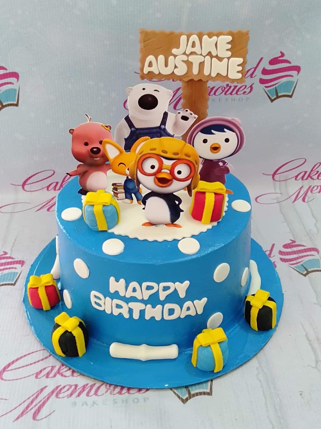 Blue Pororo and Friends themed birthday cake with character printouts and fondant gift boxes on a blue base.