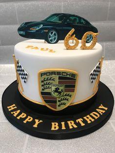 White fondant Porsche themed birthday cake with a black car printout, gold number 60, and Porsche crest on the side.
