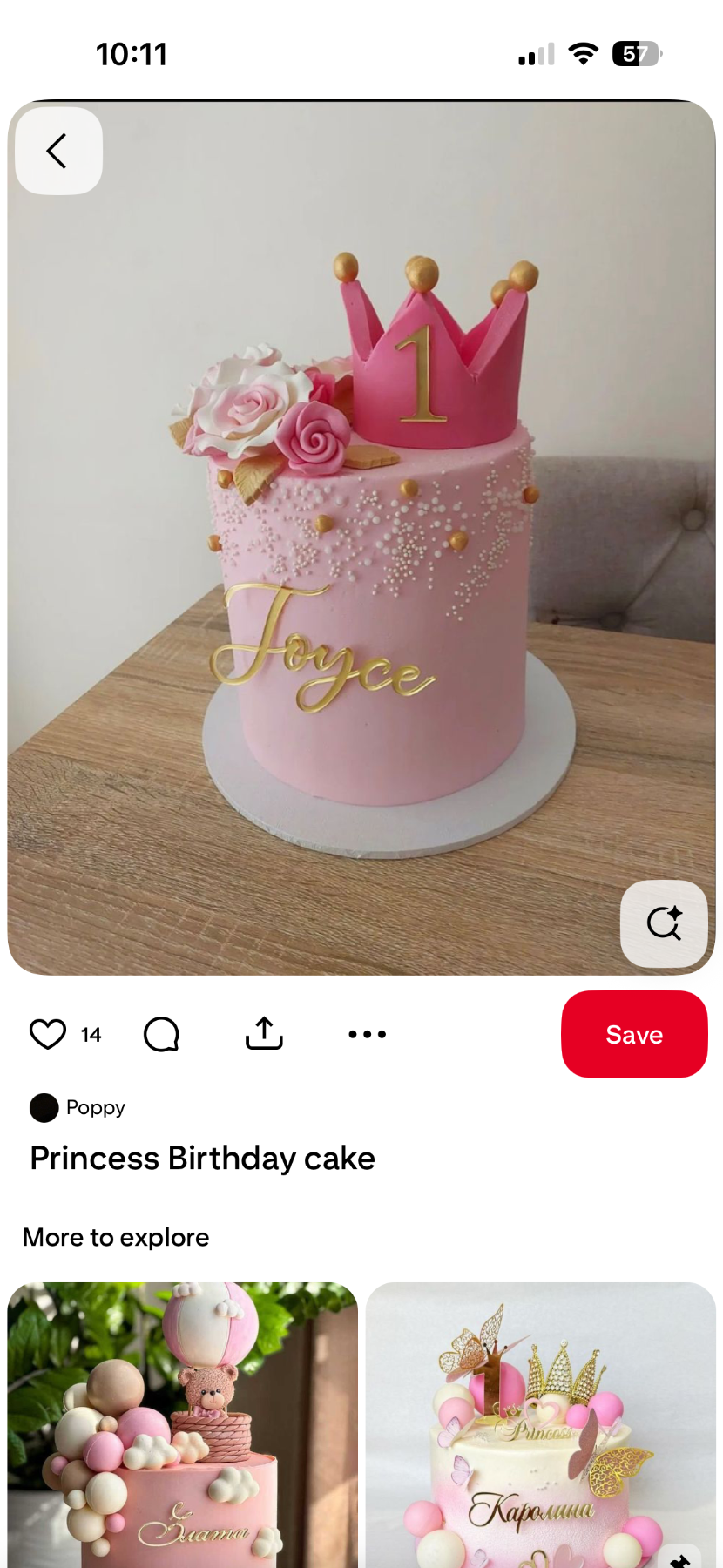 Tall pink princess birthday cake with a large pink fondant crown, edible roses, and gold name topper.