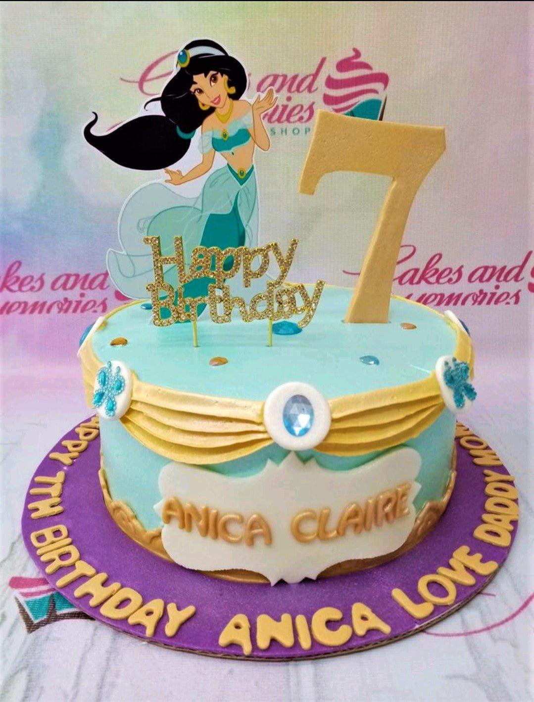 Princess Jasmine themed light blue cake with a large gold number 7 and character printout on a purple base board.