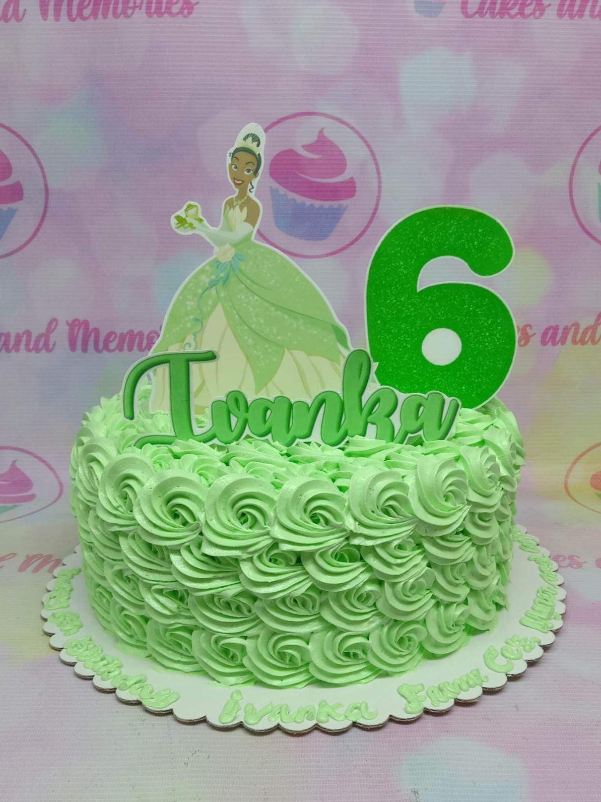 Light green 1-tier princess birthday cake with icing rosettes, a Tiana printout topper, and a large green number 6.
