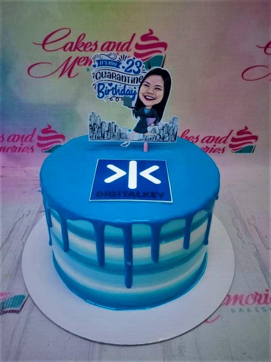 Blue and white striped birthday cake with a blue drip and a custom caricature topper for a 23rd quarantine birthday.