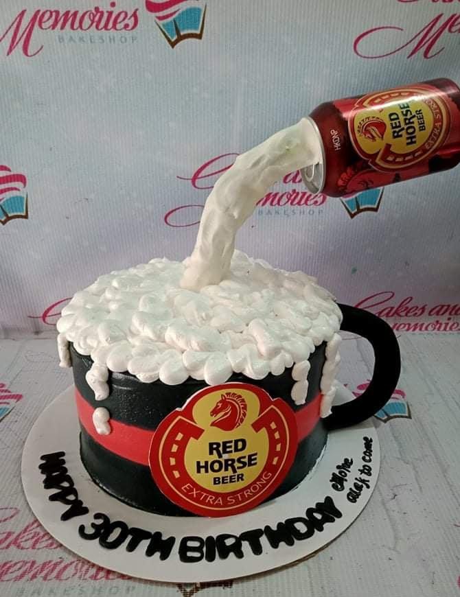 Red Horse Beer themed birthday cake with a pouring beer can effect and white icing foam.