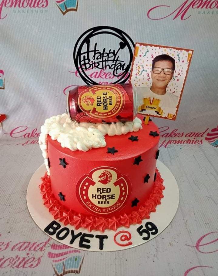 Red Horse Beer themed birthday cake with a red base, black stars, and a photo topper for a 59th birthday.