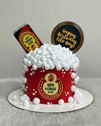 Red Horse Beer themed birthday cake with red icing, white foam dollops, and beer bottle printout toppers for Tito Boy.