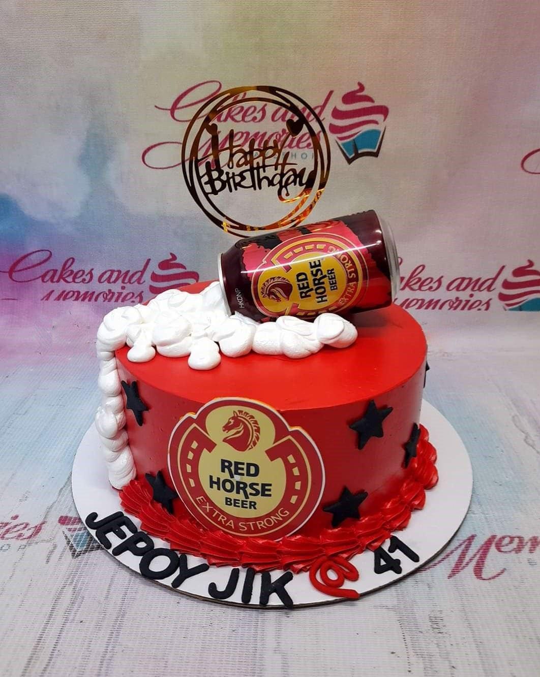 Red Horse Beer themed birthday cake with a red icing base, black stars, and a beer can topper with white foam icing.