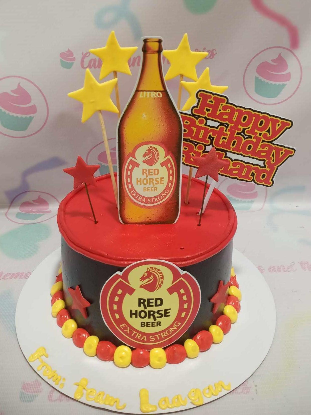 Red Horse Beer themed birthday cake with a black and red base, beer bottle printout, and yellow and red stars.