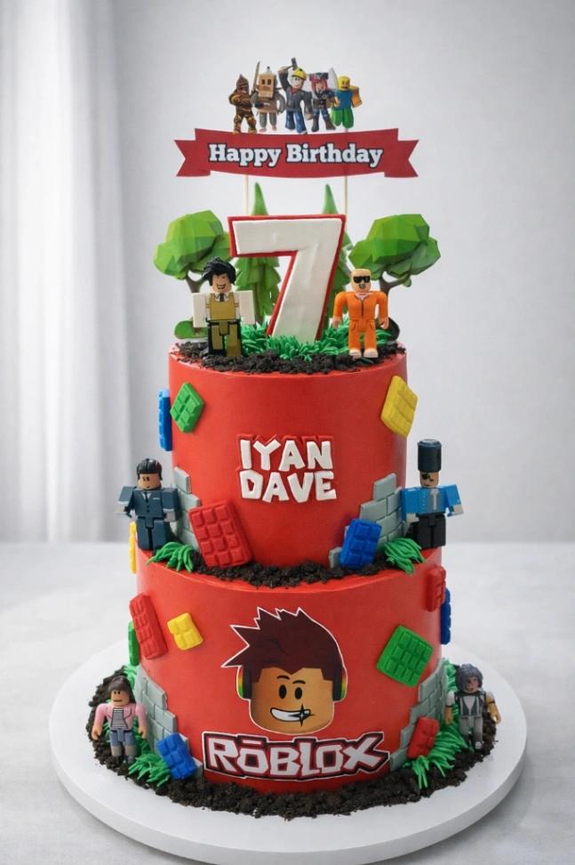 Red 2-tier Roblox themed birthday cake with character printouts, fondant building blocks, and a large white number 7 topper.