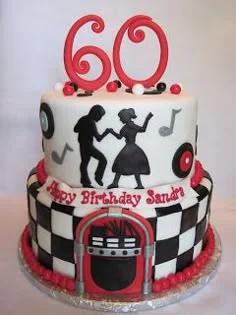 Two-tier 50s rock and roll themed cake with red 60 topper, dancing silhouettes, and a jukebox design on a checkered base.