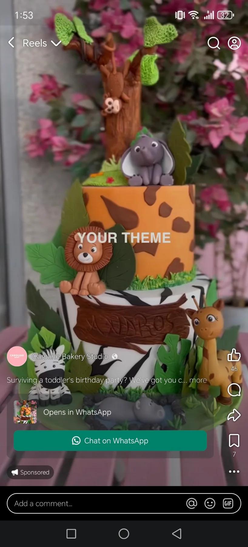 Two-tier safari themed cake with fondant lion, zebra, giraffe, and elephant figures