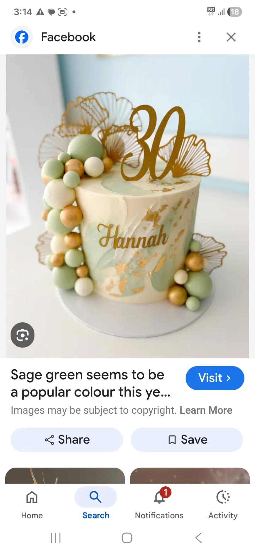 Sage green and cream 1-tier birthday cake with gold ginkgo leaf toppers, gold 30 topper, and sage green fondant balls.