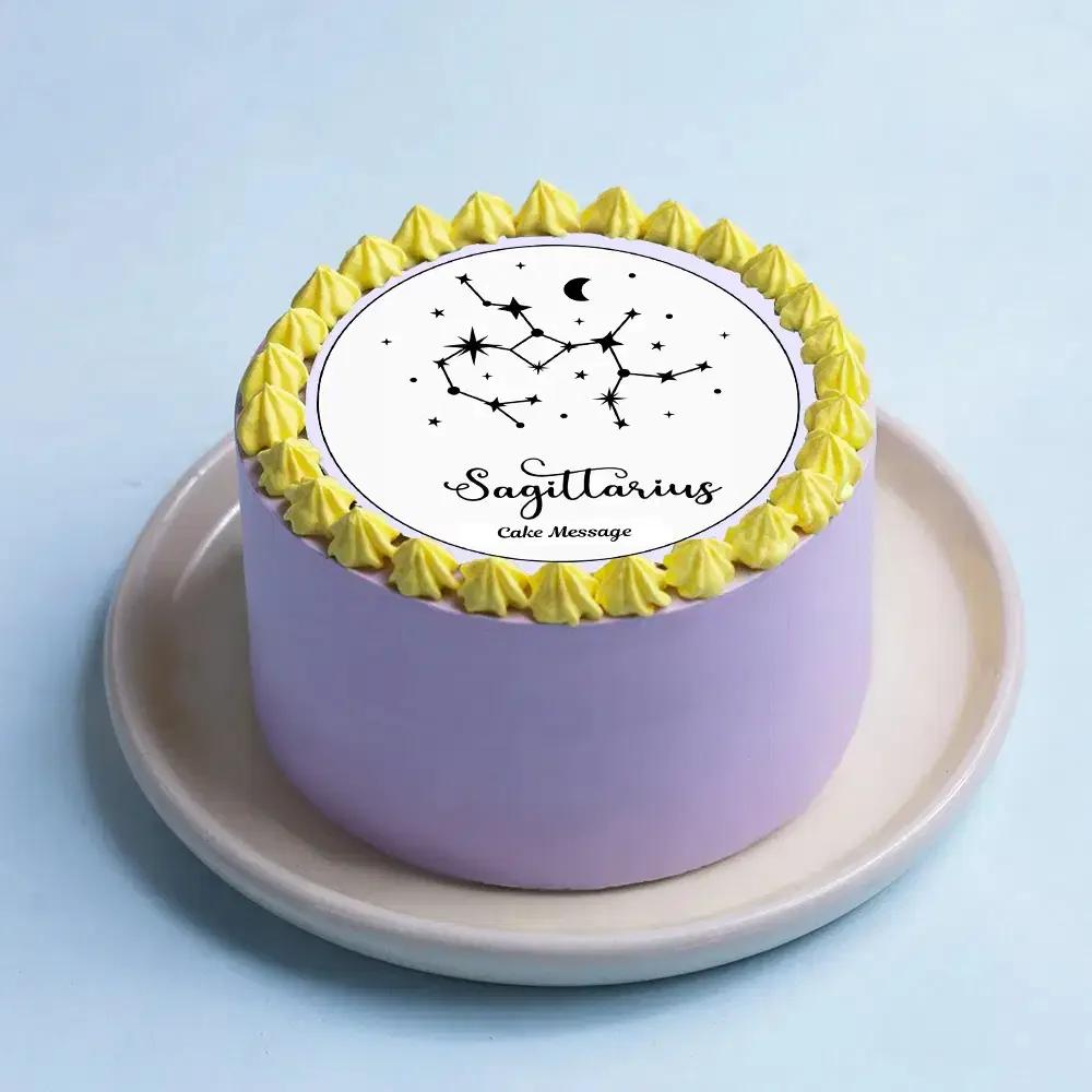 Lavender minimalist cake with yellow icing rosettes and a Sagittarius constellation printout on top.