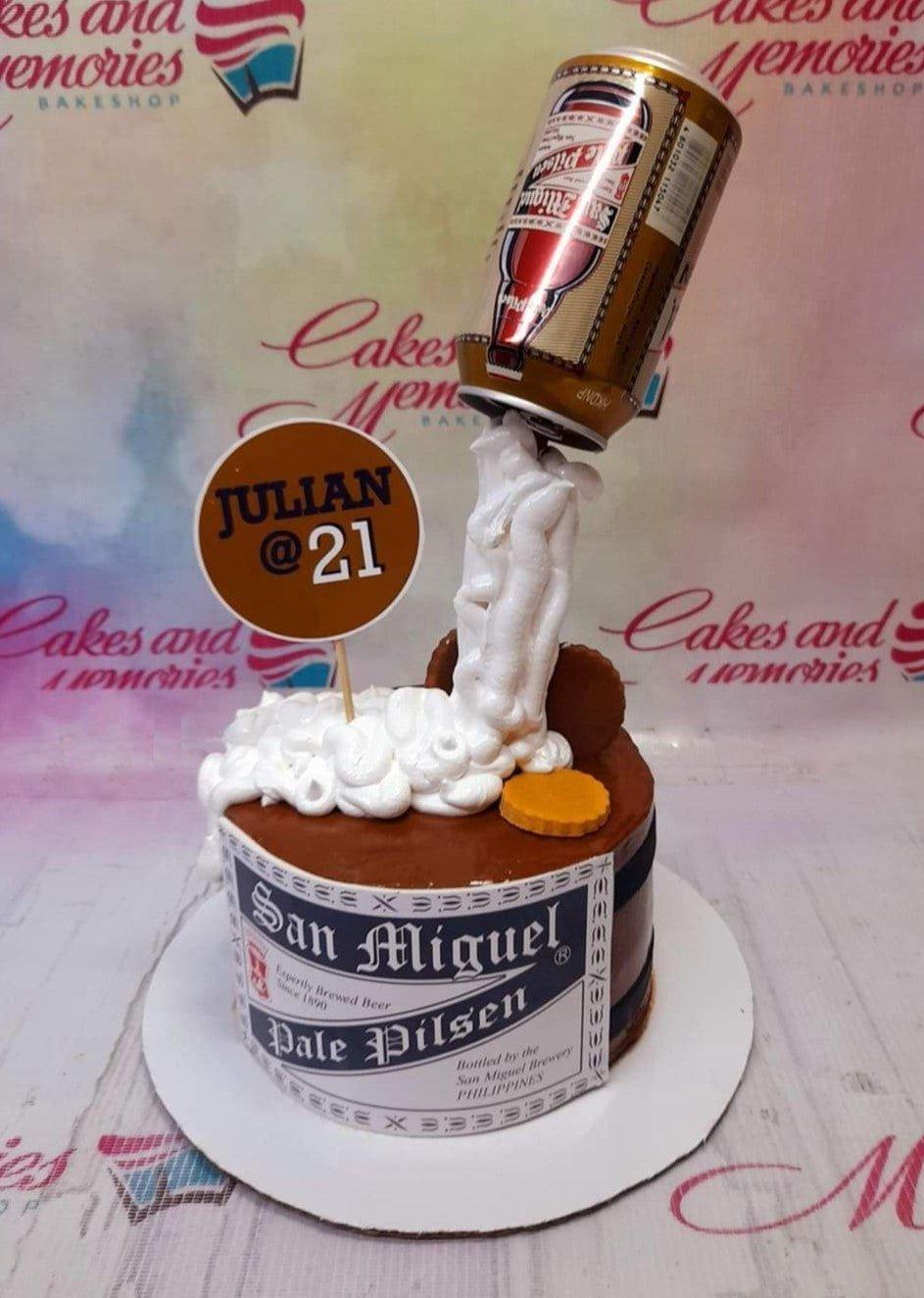 San Miguel Pale Pilsen beer themed cake with a pouring beer can topper and white icing foam.