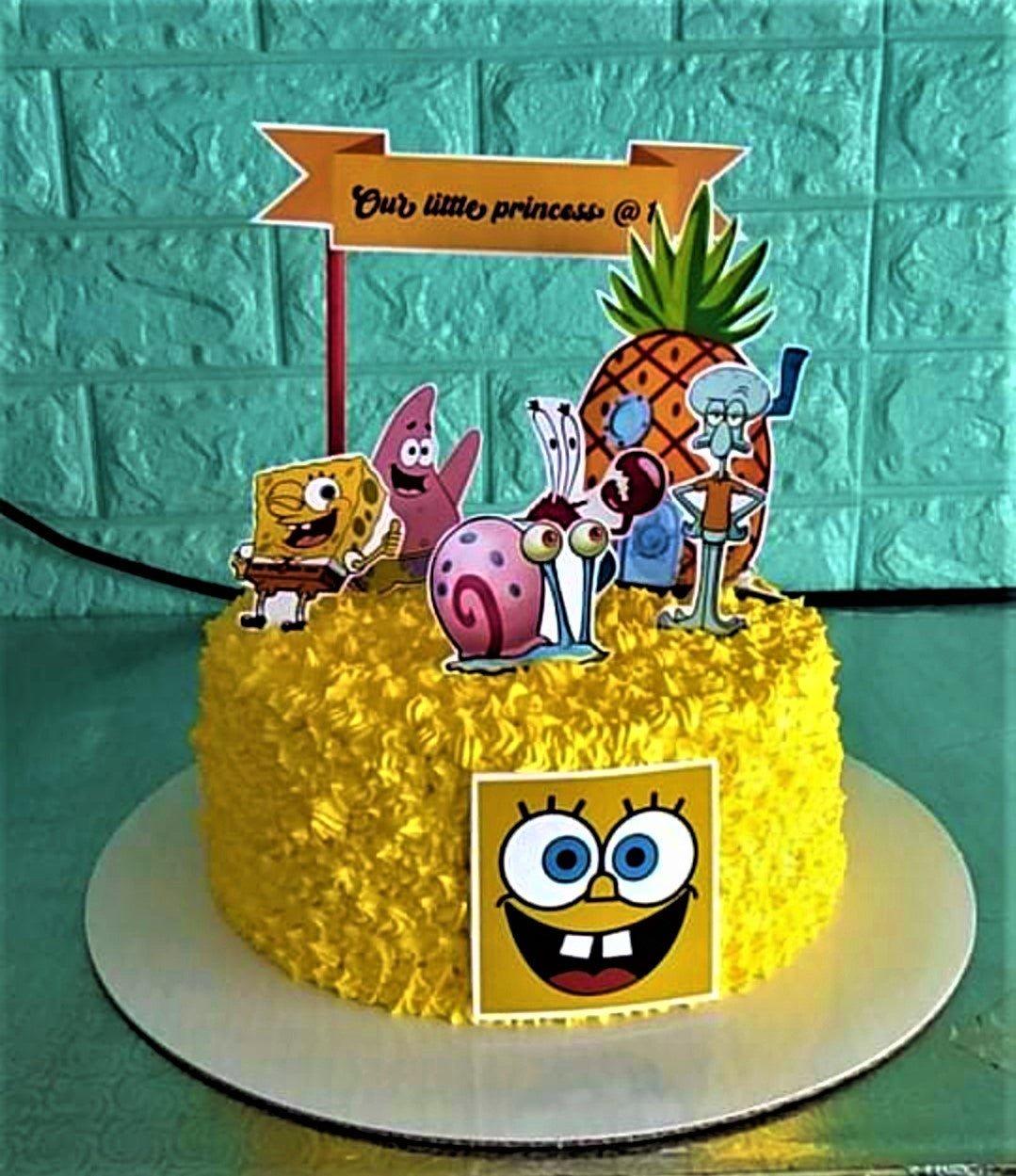 Yellow SpongeBob SquarePants themed cake with character printouts and a pineapple house topper.