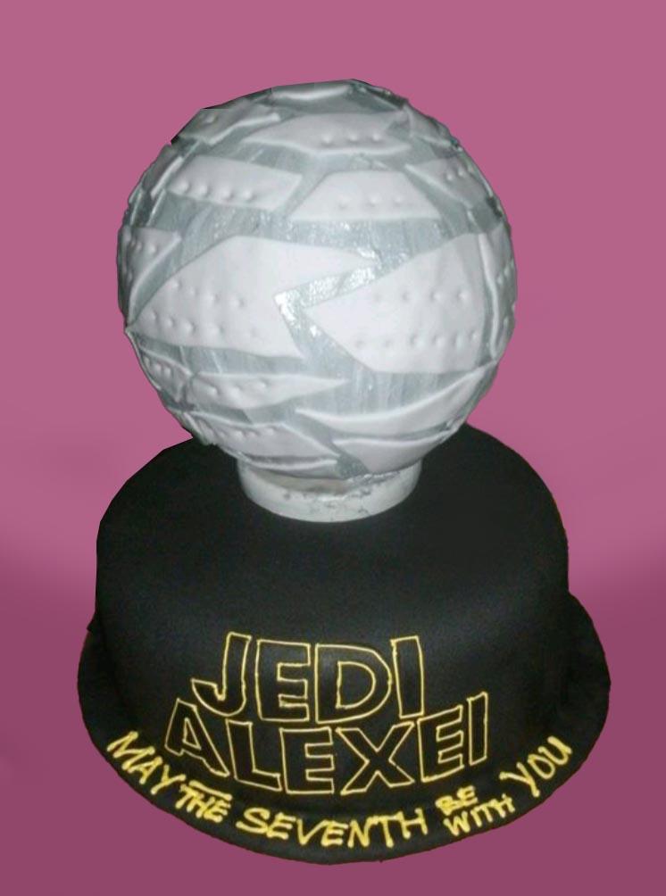 Star Wars Death Star themed black fondant cake with a large 3D Death Star topper and yellow Jedi Alexei message.