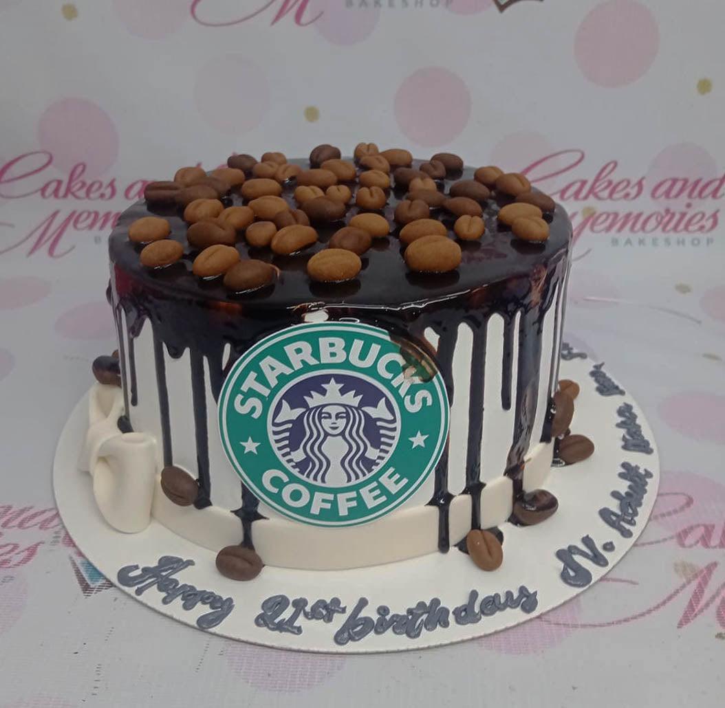 Starbucks coffee themed birthday cake with chocolate drip and coffee bean decorations