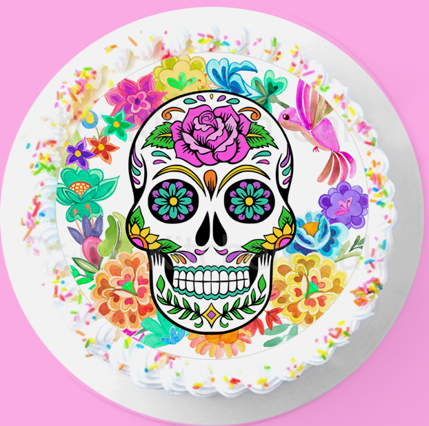 Bento cake with a colorful sugar skull printout and rainbow sprinkles on white icing.