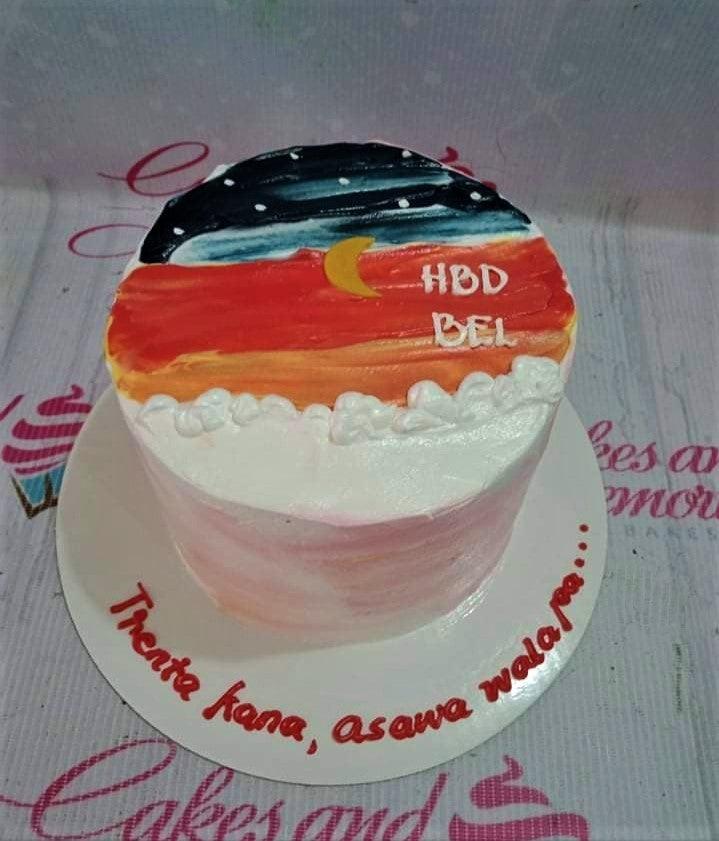 Bento cake with a sunset and night sky icing design featuring a crescent moon and white clouds.