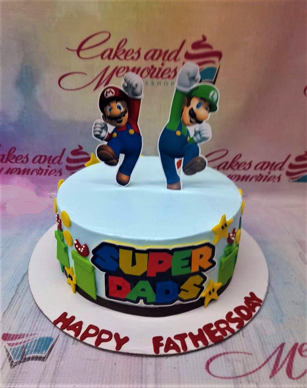 Light blue Super Mario and Luigi themed Father's Day cake with Super Dads logo and green pipes.