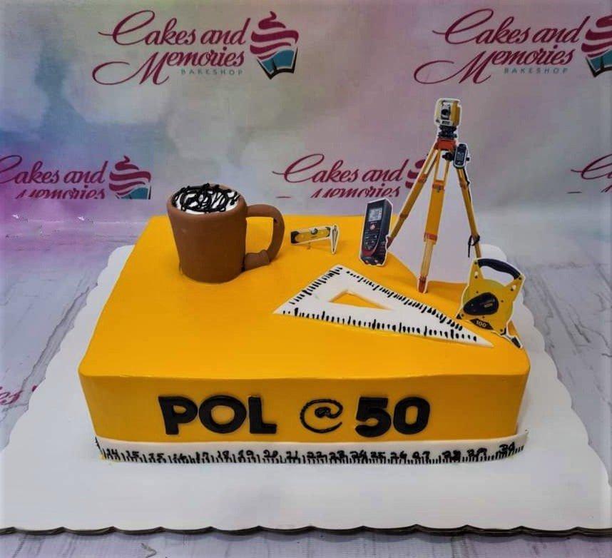 Yellow square surveyor themed birthday cake with 3D coffee mug and printed surveying equipment toppers.