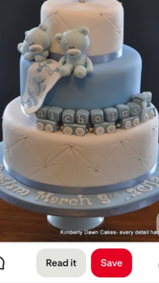 Three-tier blue and white fondant baptism cake with teddy bears, a toy train, and quilted patterns with silver dragees.