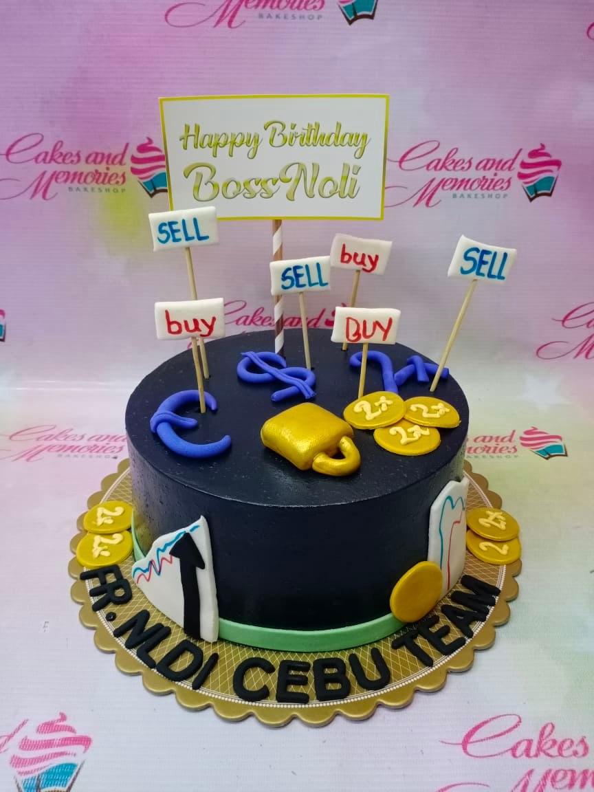 Black trading themed birthday cake with stock market charts, gold coins, and buy sell signs for Boss Noli.