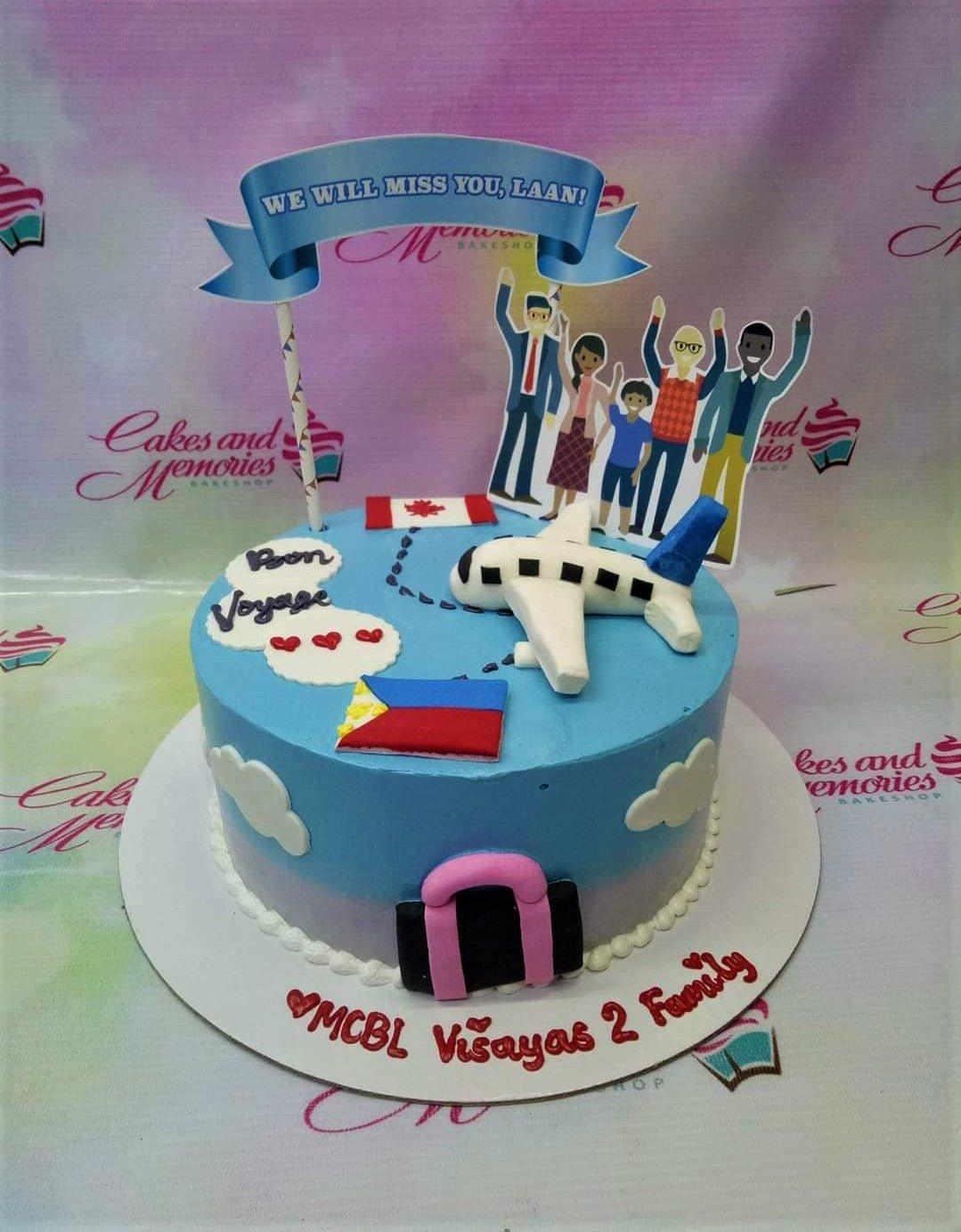 Light blue travel themed cake with a fondant airplane, Philippine and Canadian flags, and a family printout topper.
