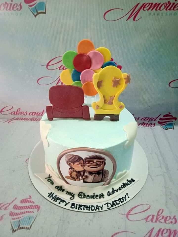 Light blue Up movie themed birthday cake for Daddy with colorful balloon toppers and Carl and Ellie printout.