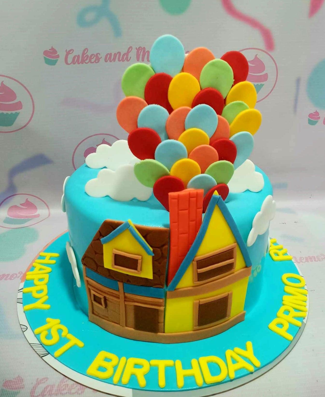 Up movie themed birthday cake featuring a fondant house with a large cluster of colorful balloon toppers and white clouds on blue icing.