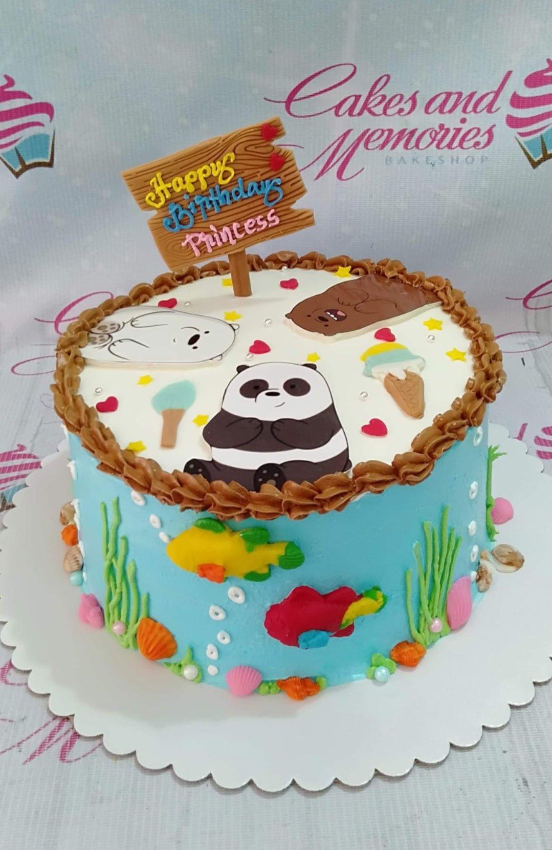 Light blue We Bare Bears underwater themed cake with Grizzly, Panda, and Ice Bear toppers and edible sea creatures.