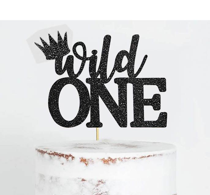 White semi-naked 1-tier birthday cake featuring a black glittery Wild One topper with a crown accent.