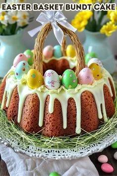Easter Basket Bundt Cake with white chocolate drip, colorful patterned eggs, and a woven basket handle with a white satin bow.